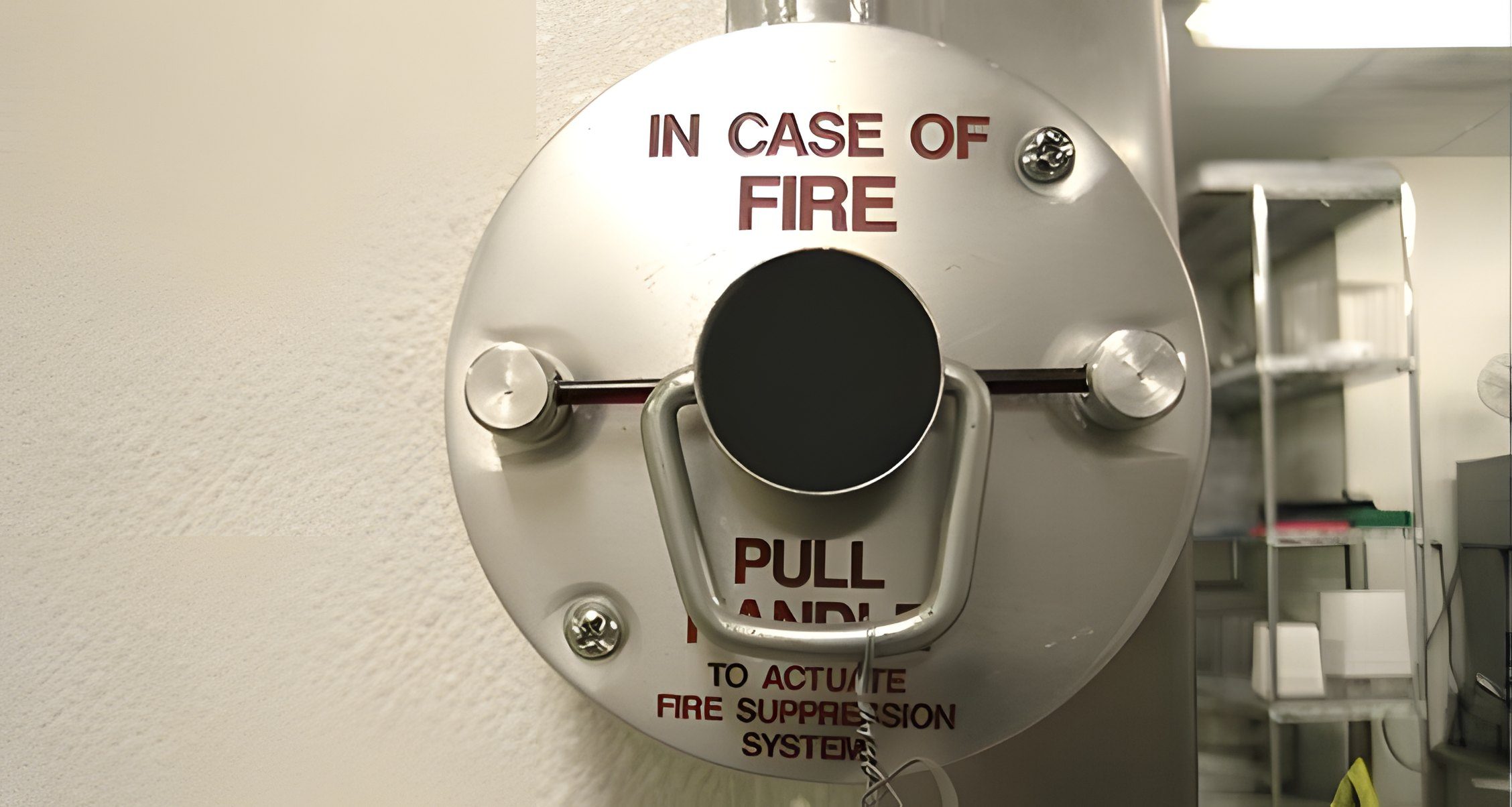 The pull handle of a fire suppression system